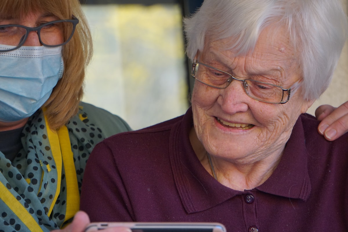 Care worker smiling with an elderly client